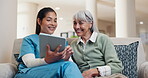Talking, tablet and nurse with old woman on sofa in home for consulting, medical app and help. Caregiver, support and healthcare review with people in living room for healing and online checklist