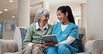 Smile, tablet and nurse with old woman on sofa in home for consulting, medical app and help. Caregiver, support and healthcare review with people in living room for healing and online checklist
