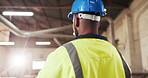 Back, man and carpenter in workshop with helmet, inspection and timber for production. Male person, hardhat and flare in factory for carpentry, lumber supervisor and ppe for manufacturing furniture