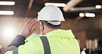Carpenter, thinking and man with helmet in warehouse, decision and planning for furniture production. Artisan, back and mature person with hard hat, flare and project inspection in factory and vision