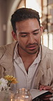 Man, reading and date with menu in restaurant for food choice, decision or checking options. Male person, brochure or pamphlet with cuisine or recipe for fine dining experience or dinner service