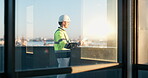 Architect, document and man outdoor for urban development planning, vision or future at worksite. Engineer, blueprint and glass window on building balcony for construction, remodeling or expansion