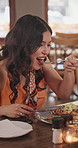 Happy woman, eating and relax with lunch in restaurant, hungry and tasty food on weekend or cuisine. Fine dining, diner and person with smile for delicious meal, hospitality and gourmet on break