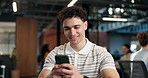 Business, man and reading in office with phone, news research and email source to confirm facts. Smile, male person or coworking in workplace with mobile, proofreading and story draft for publication