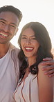 Happy, hug and face of couple outdoor on holiday for anniversary, bonding or commitment in marriage. Smile, flare and portrait of man embracing woman for connection in relationship on vacation.