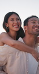 Happy, piggyback and couple outdoor on holiday, vacation or getaway for marriage anniversary. Walking, playful and man carrying woman for bonding, connection or love in relationship on weekend trip.