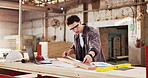 Ruler, carpenter and man with plank in workshop for project, planning and manufacture furniture. Warehouse, measurement and woodworker with equipment, timber material and small business in factory