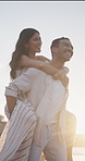 Couple, laugh and walk at beach with piggyback, bonding together and love for connection on vacation. Happy, people dating and fun outdoor by ocean with relationship, holiday and wellness on weekend.