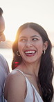 Couple, laugh and talk at beach with summer holiday, funny story and travel for romantic getaway. Flare, happy people dating and chat outdoor by ocean with love, relationship and joke for vacation.