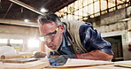 Sanding, carpenter and dust with plank in factory for project, planning and manufacture furniture. Workshop, sandpaper and mature person with equipment, timber material or small business in warehouse