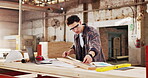 Ruler, carpenter and man with plank in warehouse for project, planning and manufacture furniture. Workshop, measurement and woodworker with equipment, timber material and small business in factory