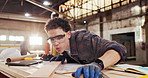 Sanding, carpenter and dust with plank in warehouse for project, planning and manufacture furniture. Workshop, sandpaper and person with equipment, timber material and small business in factory