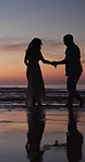 Couple, sunset and running in ocean with holding hands, water splash and playful on romantic vacation. Man, woman and travel at beach with bonding, summer holiday or fun on tropical coast in evening