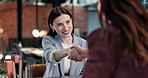 Resume, handshake and businesswoman at job interview in office for recruitment with opportunity. Discussion, cv and candidate shaking hands with hiring manager for onboarding process with portfolio.
