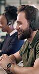 Help, support and man with headset in call center for customer service or online advice in office. Contact us, coworking or agents with smile for virtual assistance, CRM or communication in agency