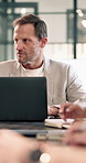 Meeting, manager and man with laptop for planning, financial review and feedback for investment. Office, computer and person with online report for finance, discussion or research for budget proposal