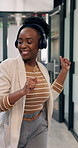 Happy, headphones and black woman dancing in office for vibe, fun energy or celebration. Excited, female person or employee with smile or listening to music or app for audio streaming in workplace