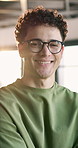 Face, creative and happy man with glasses in office for design, pride or development. Portrait, male person or designer with smile, confidence or lens flare for company improvement in workplace