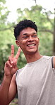 Selfie, smile and man outdoor with peace sign, digital memory or fitness hobby for social media app. Active, bokeh and happy person with emoji, connection and exercise activity with online post.