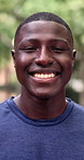 Face, athlete and black man at park for fitness, exercise and training with health benefits. Portrait, male person and happy in nature with runner, positive attitude and sports workout for wellness