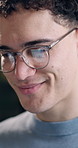 Glasses, online and man with smile in office, research or data analysis for budget review on website. Business, financial analyst and happy person with eyewear, reflection and report with graphs