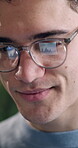 Research, online and man with glasses in office, reading and data analysis for budget review on web. Business, financial analyst and happy person with eyewear, reflection or report with graphs on app