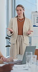 Business, woman and talking in office for presentation, training and finance graphs for marketing. Speaker, coaching and team in workplace with whiteboard, data analytics and stats of financial sales