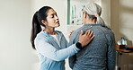 Massage, women and spine injury in physical therapy session for healing, consultation and healthcare. Person, senior patient and back pain with rehabilitation, chiropractic and joint wellness