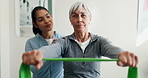 Physiotherapist, support and old woman in clinic with resistance band, help and advice for healing. Senior person, healthcare worker and talk with stretching exercise, injury recovery and wellness.