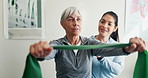 Physio, stretching and old woman in clinic with resistance band, smile and help for rehabilitation. Senior person, healthcare worker and happy with arm exercise, injury recovery or fitness equipment.