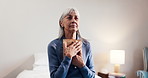 Senior, woman or thinking with picture frame in home for past memory, loss or mourning. Elderly, female person or widow with hug, photograph or moment of silence for grief, love or embrace in bedroom