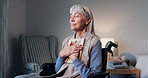 Elderly, woman or wheelchair with picture frame in home for past memory, loss or mourning. Senior, hug or female person with a disability, photograph or moment of silence for grief or love in house