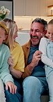 Playing, parents and kids with tickle in home for bonding, laughing and security on weekend. Love, people and children with funny game on sofa for family connection, relationship development or happy