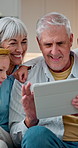 Happy, grandparents and children at house with tablet, social media and browsing for movies. Smile, old people and kids in living room with digital, streaming film and playing games for weekend break