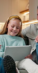Happy, father and child at house with tablet, social media and browsing website for movies. Smile, parents and daughter in living room with digital, streaming film and comedy video for weekend break