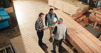 Carpenter, team and discussion above for manufacturing, timber inventory or quality control. Production, woodwork and planning with men in warehouse for joinery project, tablet or stock inspection