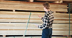 Man, carpenter or counting wood with tablet in warehouse for lumber production or supply chain. Male person, carpentry or checking stock with technology for timber distribution or storage inspection