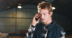 Carpenter, phone call and man in warehouse with stress for mistake, error and delay in timber production. Carpentry, frustrated and person on cellphone for communication, contact and schedule problem