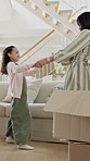 Mom, box and dancing with child in home for bonding, moving in or fun relocation together. Mother, kid or daughter holding hands with guardian or cargo for celebration or connection in new house