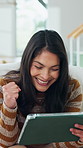 Woman, celebration and remote work in home with tablet, good news or notification for job opportunity. Freelancer, person and fist pump in living room with tech, happy or announcement of hiring offer