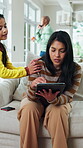 Remote work, child and disturb mother with tablet to play, distraction and bother in family home. Tech, girl and attention with freelance parent on sofa in living room, busy and annoyed with daughter