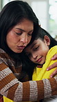 Mother, hug and console daughter in house with love, talk and understanding for child development. Woman, comfort sad kid and discussion in living room with care, embrace and compassion for emotions.
