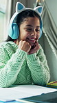 Child, elearning and laptop with headphones for video call, wave and knowledge development in home. Happy, girl and greeting in house with computer, audio tech or online class for distance education.