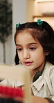 Learning, growth and girl in home with abacus, math practice or fun activity in literacy skills. Education, numeracy or child with calculation, bead counting or number play for cognitive development.