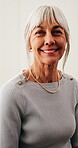 Wellness, face and senior woman in house with smile, positive attitude and weekend break with unwind. Wellbeing, portrait and elderly person with confidence, good mood and satisfaction in retirement.