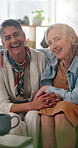 Face, hug and laughing with lesbian couple in home together of affection, commitment or connection. Funny, lgbt relationship and morning with happy senior women in on sofa apartment for security