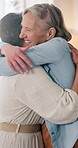 Hug, laughing and moment with lesbian couple in home together of affection, commitment or connection. Funny, lgbt relationship and morning with happy senior women embracing in apartment for security