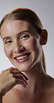 Face, skincare and touch with happy woman in studio for cosmetics, dermatology or hydration. Aesthetic, beauty and smile with person on white background for facial grooming, feeling or wellness