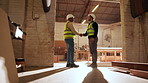 Carpentry, hello or people in factory with handshake, greeting or negotiation in woodworking. Welcome, flare or artisans with shaking hands, team introduction or partnership deal in timber warehouse.