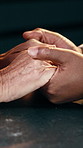 People, love or holding hands with empathy for understanding, hope or romantic date together in home. Elderly, relationship or bonding with comfort for emotional support, faith or care in house